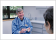Dr. Alan Brodine explains tooth replacement options using a dental model at Brodine Prosthodontics in Rochester, NY