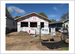 Custom 5-inch seamless eavestrough installation featuring leaf gutter guards, soffit, and fascia engineered to redirect heavy rain and melting snow away from a home foundation.