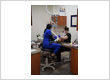 Dental team performing a restorative dentistry procedure on a patient at Roman Dental Arts in Hackensack, NJ