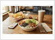 Chipotle meal with burrito bowl, chips and drink