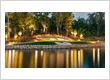 sun setting over lake with 12th hole Augusta National putting green