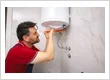 imgi 125 Plumber in Las Vegas repairing a traditional tank.jpg