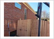 Residential Brick Home Fence Installation