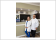 Dr. Alissa Roman and Dr. Donald J. Roman at the front desk of Roman Dental Arts, a family dentistry practice in Hackensack, NJ