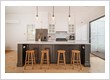 Open plan kitchen renovation of Ipswich Queenslander with building design by Three Stems Design