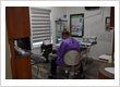Dental hygienist performing a preventive teeth cleaning appointment at Roman Dental Arts in Hackensack, NJ