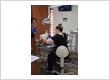Dental hygienist and assistant providing preventive dental cleaning and exam for a patient at Roman Dental Arts in Hackensack, NJ