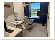 A modern, fully equipped restorative dentistry treatment room at Comprehensive Dentistry in Saline, MI