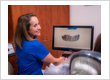 Dental team member reviewing a 3D digital dental scan for same-day crown or restorative treatment at Roman Dental Arts in Hackensack, NJ