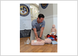 The photo is of our owner Kyle Hastings, demonstrating CPR on a manikin.