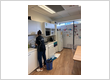 Commercial cleaner maintaining cleanliness and hygiene in an office kitchen area