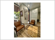 Modern and stylish waiting area with a decorative silver centerpiece, and contemporary wall art at Orlando dentist Lake Lucerne Cosmetic and Implant Dentistry