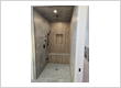 Steam shower with heated floor and bench for client in Bearspaw Calgary